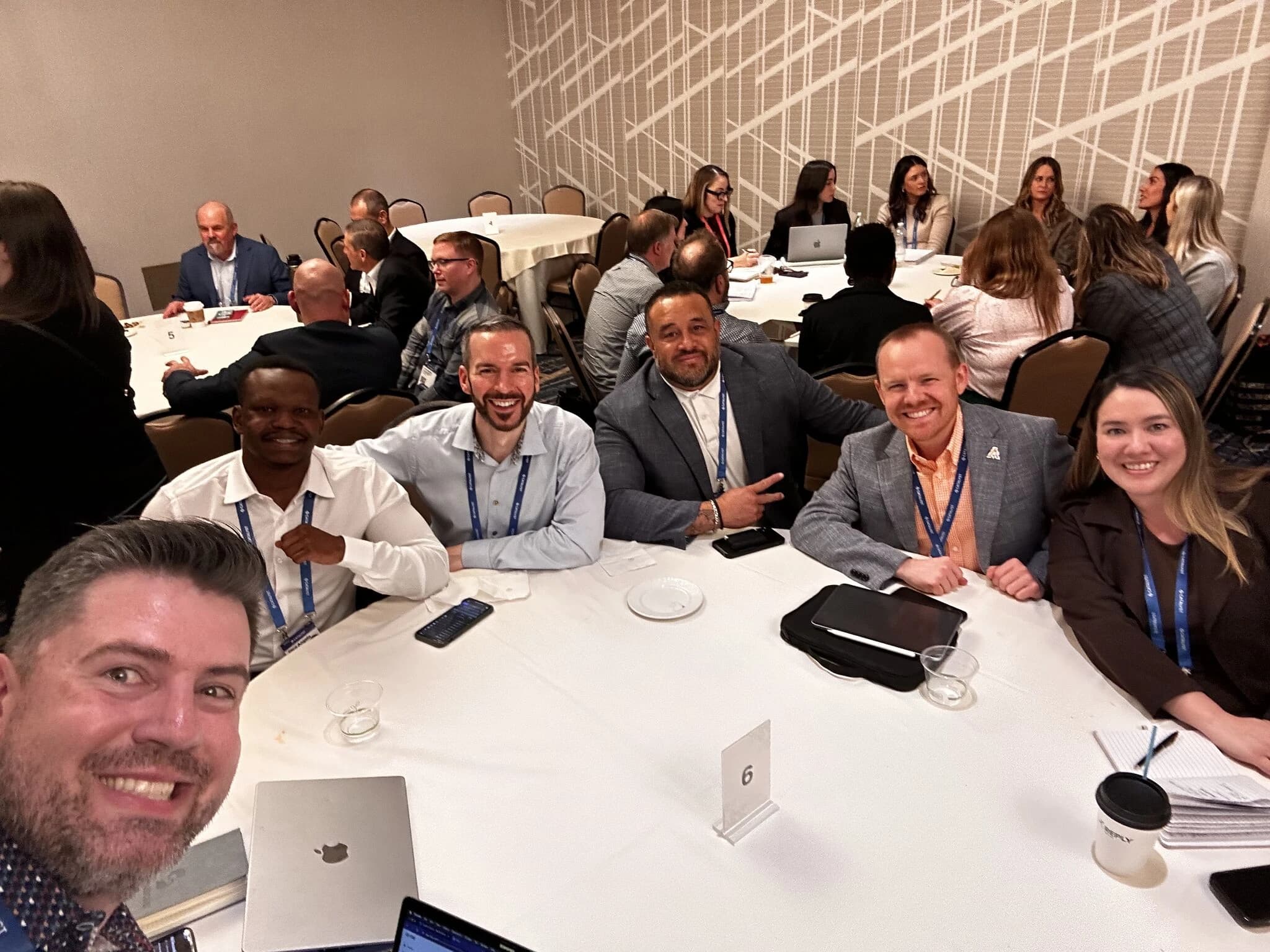 Dico at the Catalyst Summit ballroom table with partner-org peers