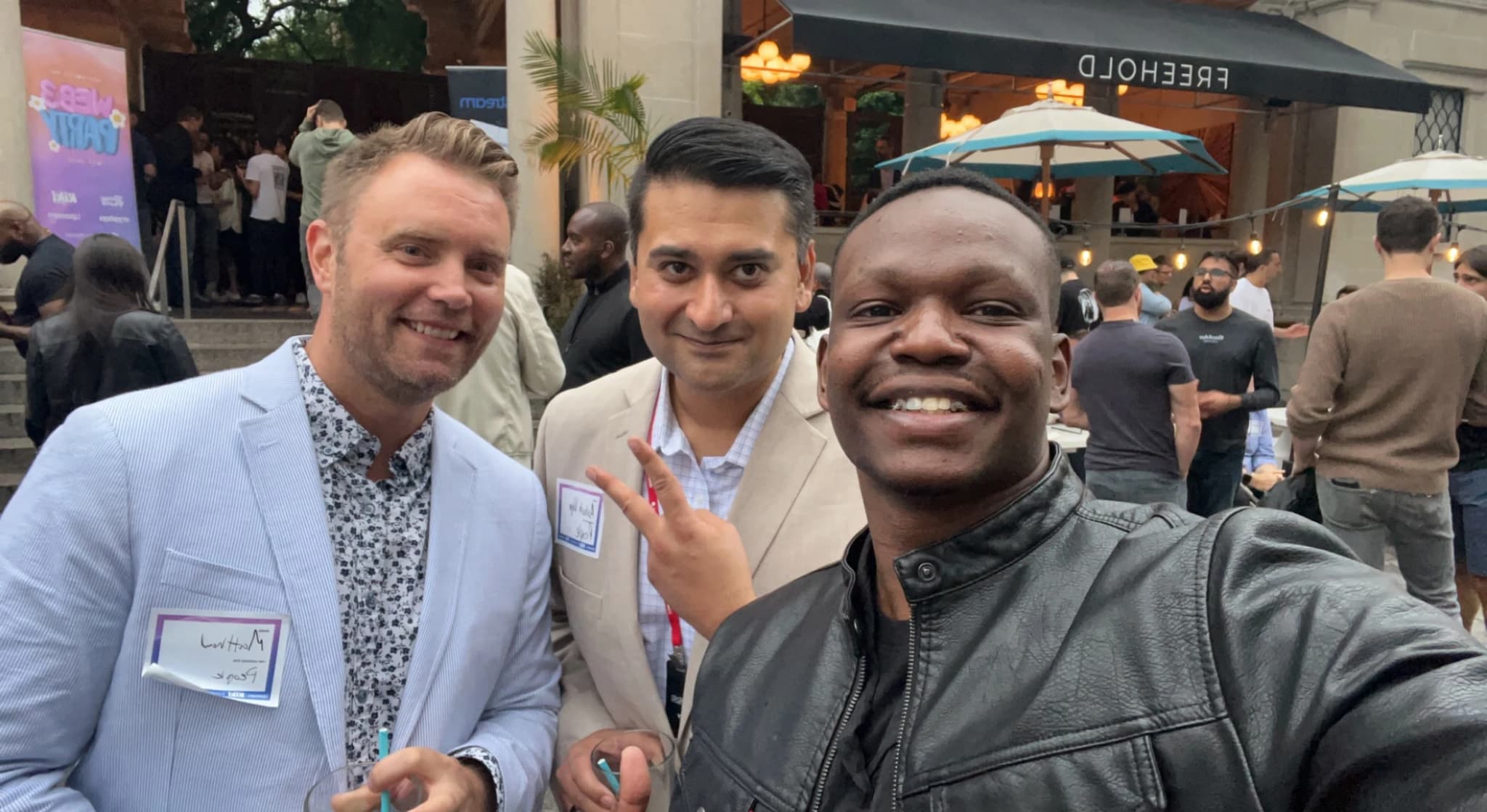Dico with two partners at an event